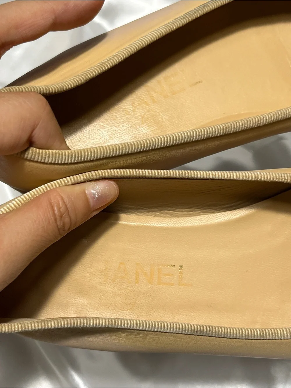 CHANEL Beige Leather Ballet Flats with Black Cap Toe and CC Logo